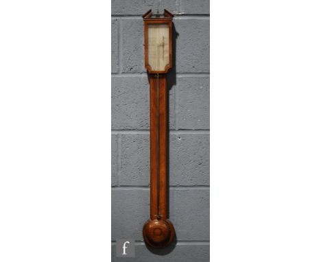 An early 19th Century mahogany stick barometer, the architectural pediment cornice above the silvered register, signed 'Picke