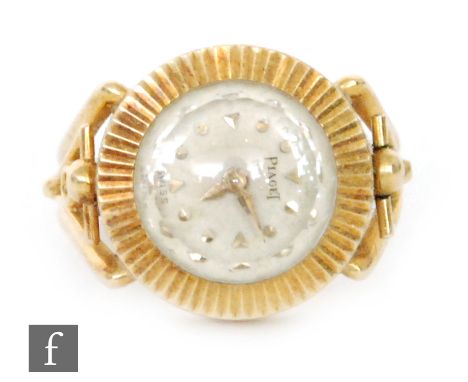 An 18ct hallmarked ladies Piaget ring watch, batons to a circular dial and split shoulders, total weight 9.4g, import mark 19