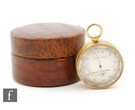 A Negretti and Zambra pocket barometer No 10772 in brass barrel form, the reverse side as a compass with locking button, in p