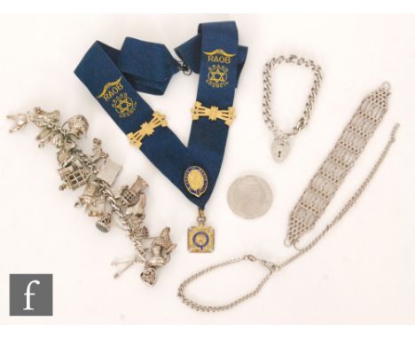 A hallmarked silver charm bracelet with three further silver bracelets, a silver crown and an Order of the Buffalo's sash.