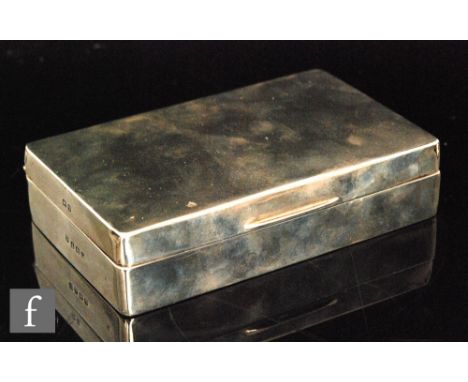 A 20th Century hallmarked silver rectangular cigarette box, the hinged cover with engine turned decoration, length 14.5cm, Bi