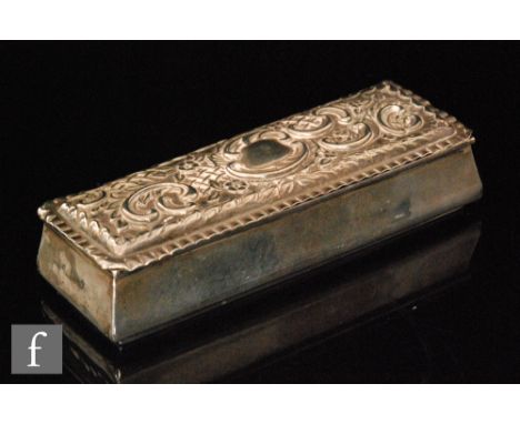A Victorian hallmarked silver box of rectangular form, the hinged cover embossed with foliate scrolls, length 13.5cm, Birming