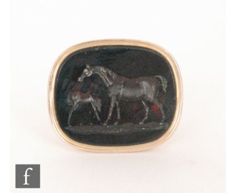 A 19th Century 18ct fob with central red stone intaglio carved with a horse and foal, total weight 12.5g.