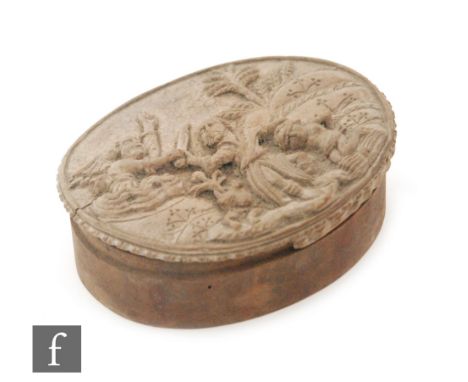 An 18th Century or earlier oval wooden snuff box, the cover carved with a scene from the Old Testament depicting the sacrific
