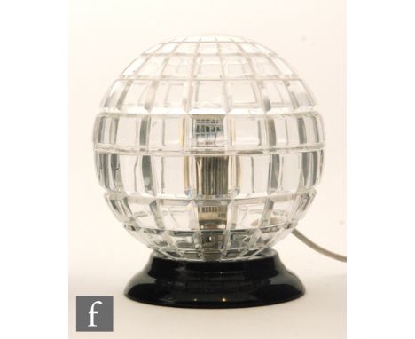 A later 20th Century Riedel spherical table lamp, the clear crystal in two halves and mitre cut with lines of longitude and l