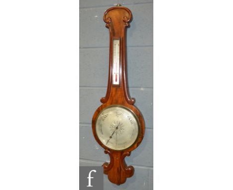 A 19th Century mahogany wheel barometer of scroll outline, circular silvered dial below a thermometer, height 102cm