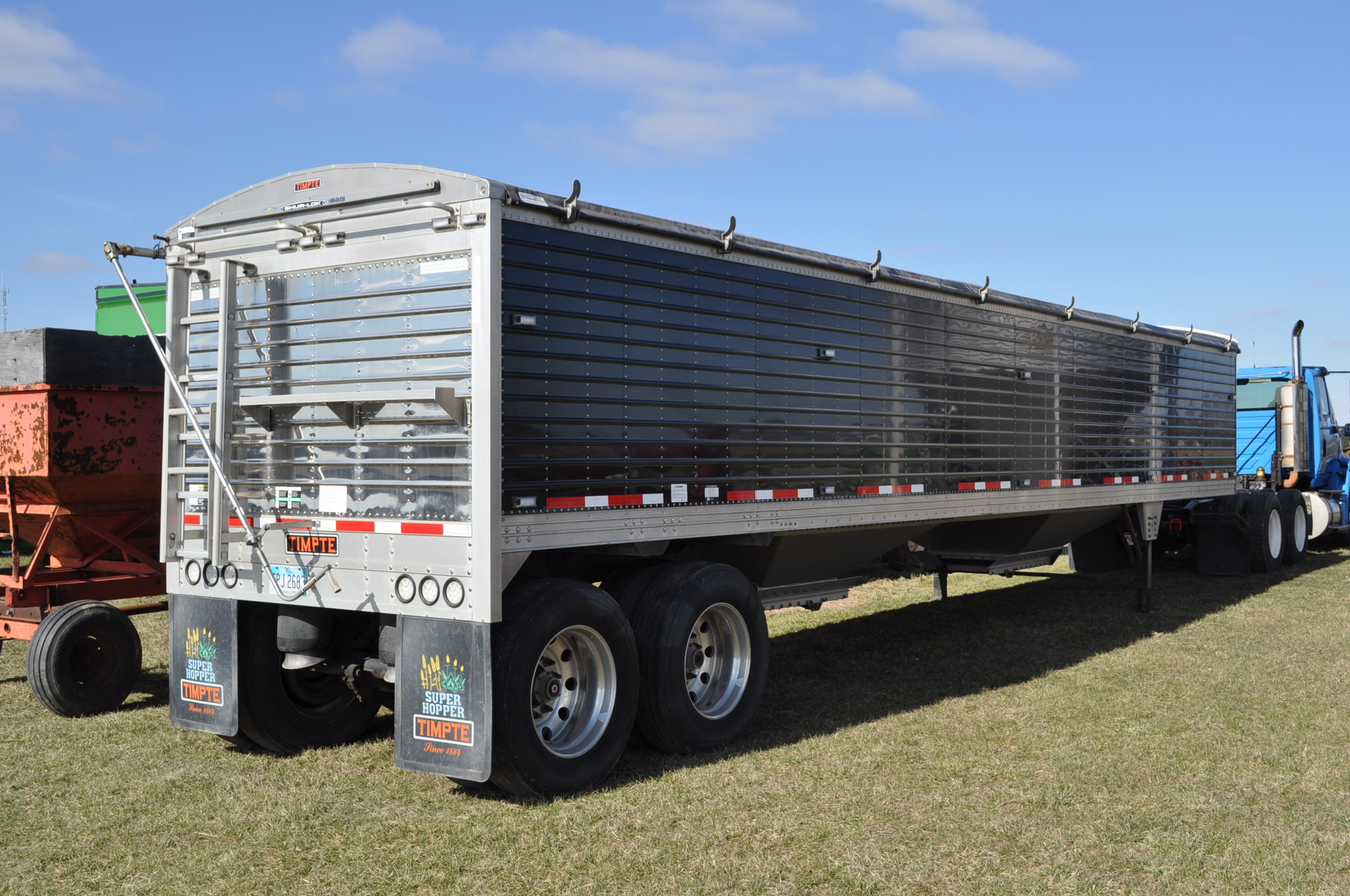 40' 2011 Timpte hopper bottom trailer, black sides, ShurLok roll tarp, air ride, 24.5 tires, out