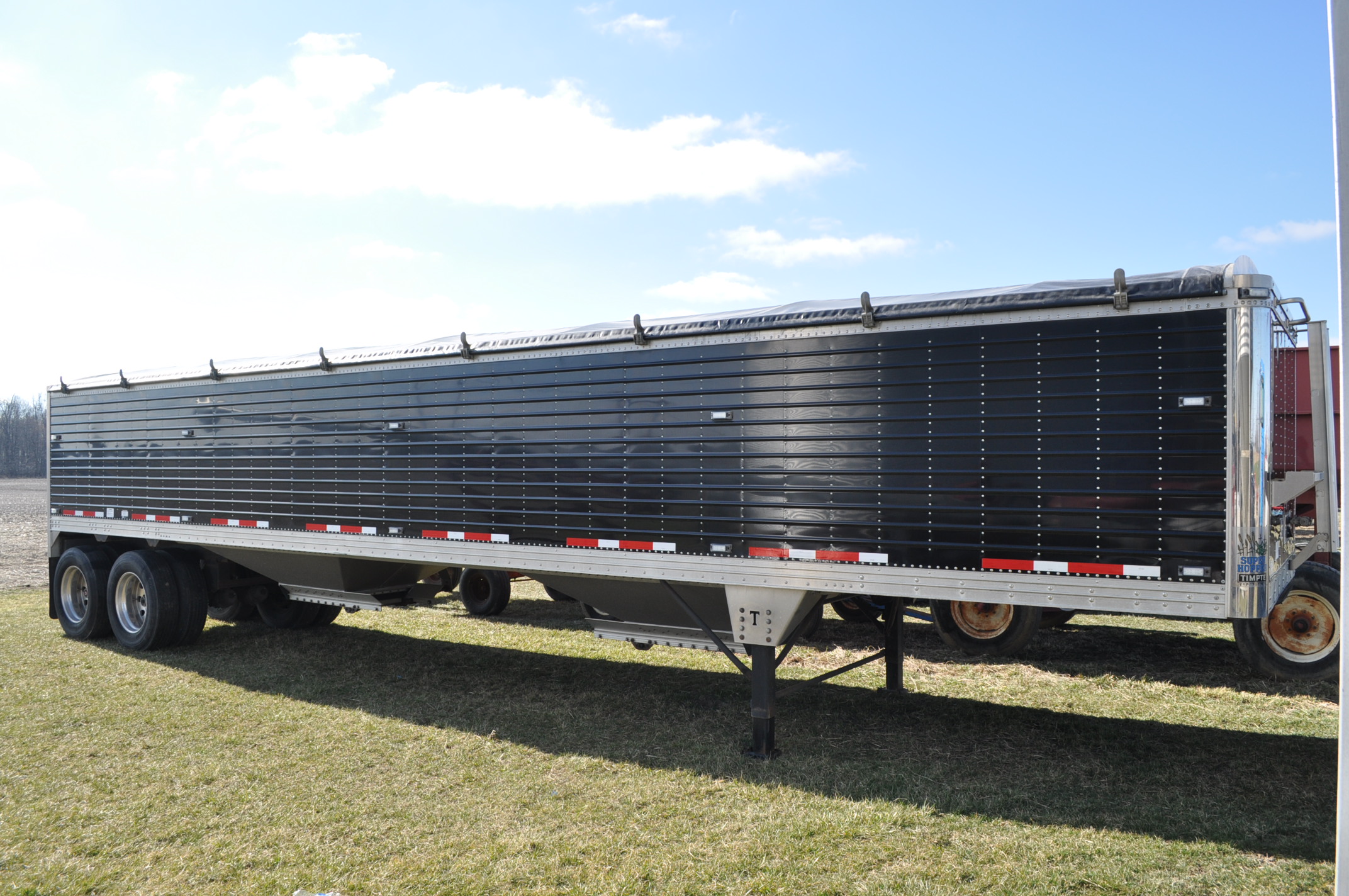 40' 2011 Timpte hopper bottom trailer, black sides, ShurLok roll tarp, air ride, 24.5 tires, out