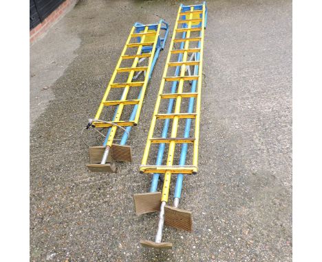 A metal tripod ladder, 320cm high, together with another smaller (2)
