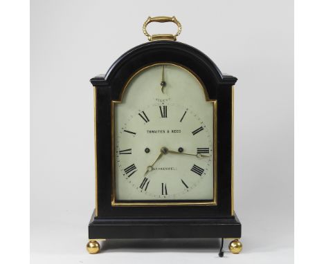 A 19th century ebonised bracket clock, with pierced grille sides, surmounted by a gilt metal handle, the painted dial signed 