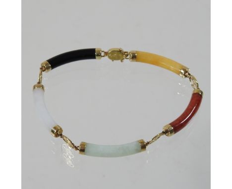 A 14 carat gold and jade coloured hardstone bracelet