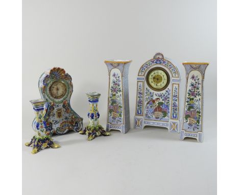 A faience pottery clock garniture, together with another smaller, 29cm high