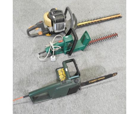 A Black &amp; Decker electric chainsaw, together with two hedge trimmer's 