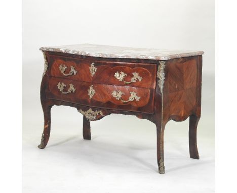 An 18th century French marble top commode, of serpentine shape, with ornate brass mounts, containing a pair of long drawers, 