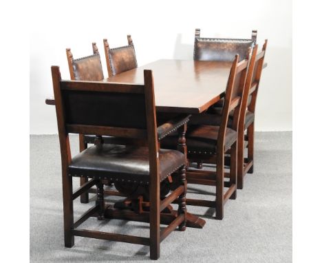 An oak refectory table, 202 x 88cm, together with a set of six brown studded upholstered dining chairs, to include two carver