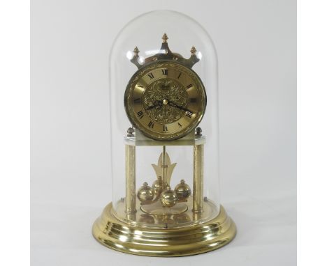 An anniversary clock, under a dome, 28cm high