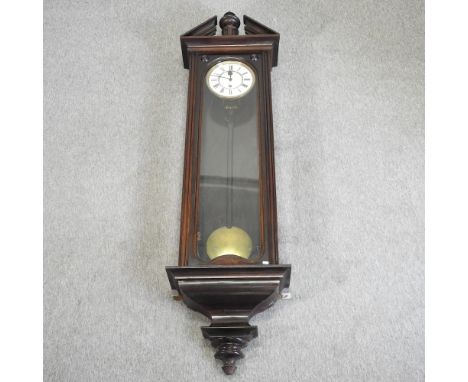 A large 19th century continental stained pine cased wall clock, 200cm high