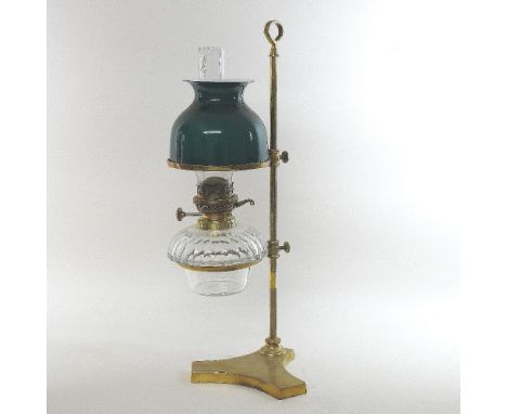 A Victorian Hinks &amp; Son Ltd patent brass student's lamp, with a fact cut glass reservoir and adjustable green glass shade