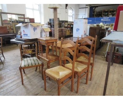 A collection of furniture to include three rush seated ladder back chairs, a dining chair, DVD rack and nest of tables