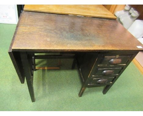 A vintage oak drop flap desk, having three drawers to one side, height 29ins, depth 19ins, width (with flap down) 34ins, max 
