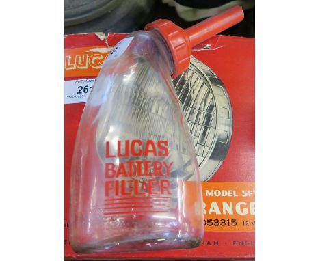 A BOXED LUCAS CAR HEADLAMP, TOGETHER WITH AN OIL BOTTLE