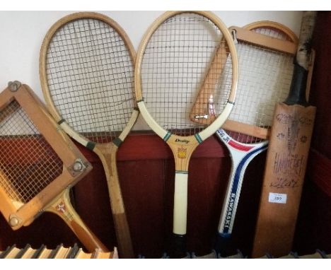 Four vintage tennis rackets, two racket presses and a child's cricket bat