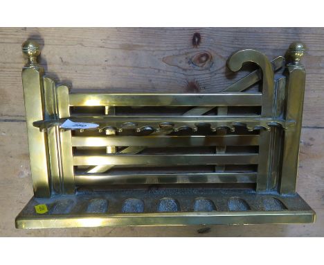 A HEAVY CAST BRASS FIVE BAR GATE PIPE RACK