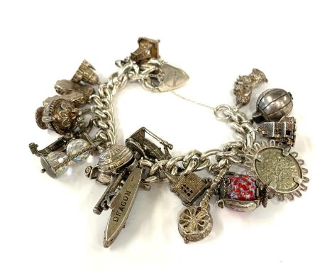 Heavy vintage silver charm bracelet weight 135g please see images for details 