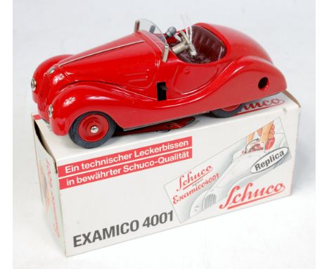 Schuco, 4001 Examico tinplate clockwork car, limited edition production, red with red interior, red plastic hubs, appears in 