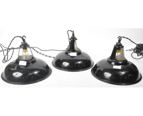 A matching group of three retro vintage mid 20th Century industrial hanging / ceiling porcelain enamel pendant lights having 