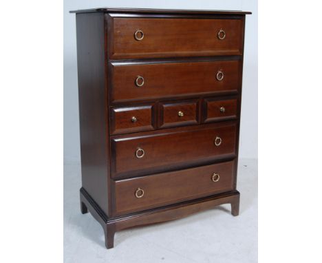A vintage 20th Century Stag Minstrel mahogany tallboy chest of drawers having a flared top with four full drawers and three s