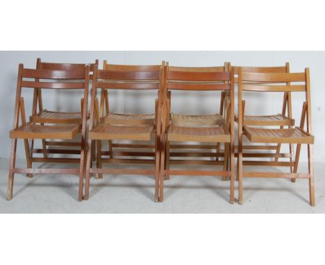 A set of eight vintage retro mid 20th century Air Ministry type folding chairs. The chairs having curved backrests with slate