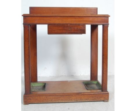 A Victorian 19th century Arts &amp; Crafts mahogany umbrella / stick stand with pierced top having stub gallery back over dri