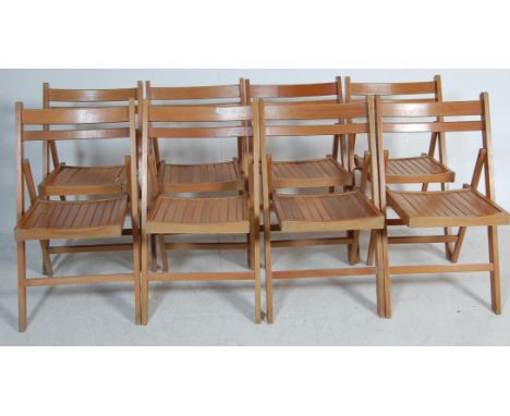 A set of eight vintage retro mid 20th century Air Ministry type folding chairs. The chairs having curved backrests with slate