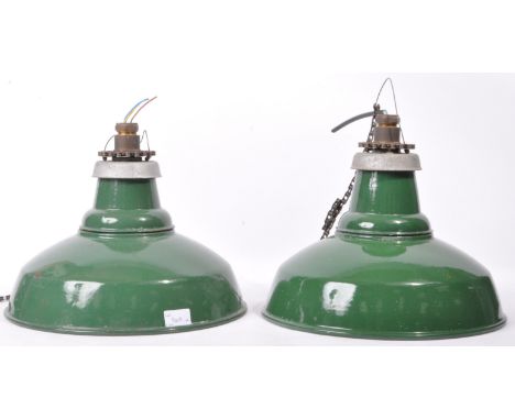 A matching pair of retro vintage 20th Century industrial green and white porcelain enamel hanging pendant light shades each w