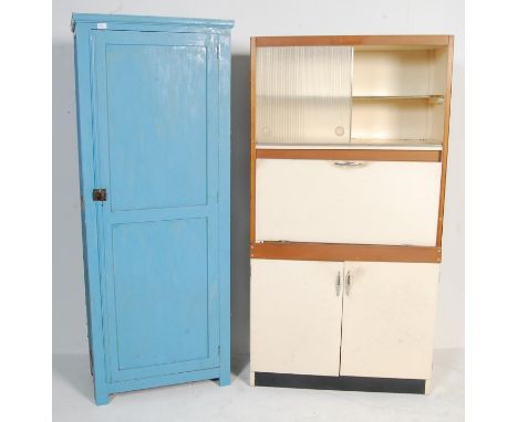 A pair of vintage retro mid 20th century circa 1950’s kitchen cupboard of a tall pedestal form. One of a tall form with singl