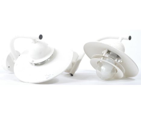 A matching pair of retro vintage 20th Century exterior wall mounted lamp light. Each having a tubular metal arm supports with