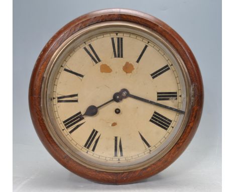 An antique early 20th century Victorian style mahogany station wall hanging / postman's / railway clock having a circular mah