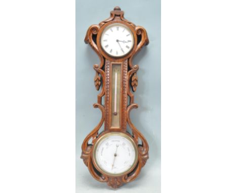 An early 20th century circa 1920’s oak carved barometer / clock. The barometer having 38 hour brass movement with white dial,
