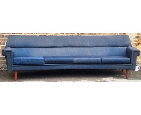 A retro vintage mid 20th Century 1950's / 1960's Danish four person sofa settee of curved form raised on tapering wooden legs