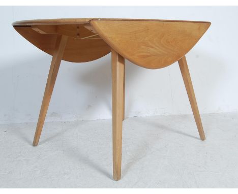 Lucian Ercolani - Ercol - 384 - A retro vintage 1960's beech and elm round drop leaf dining table having a circular table top