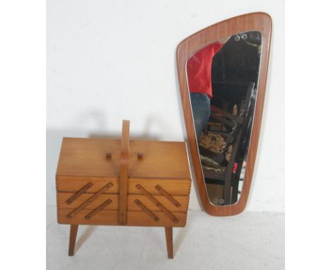 A retro vintage late 20th century teak wood mirror of tapering form together with a retro vintage teak cantilever sewing box 