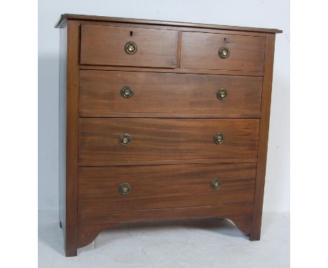 An early 20th century circa 1930’s mahogany chest of drawers of a tall rectangular form with two shot drawers over three long