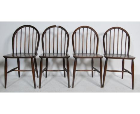 Ercol - Lucian Ercolani - &nbsp;A set of four retro vintage mid century Utility beech and elm Windsor dining chairs having ho