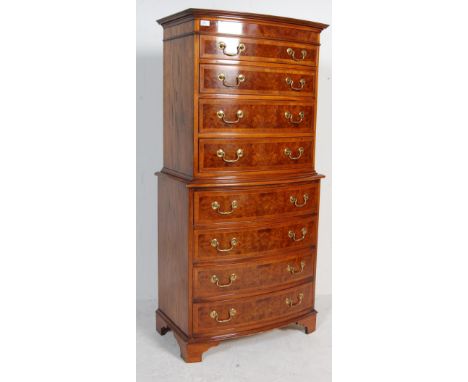 A contemporary Georgian antique style bow front tall boy chest on chest of drawers, each chest having four drawers each havin