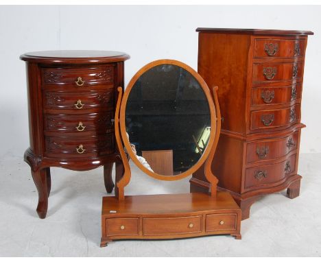 A contemporary mahogany cylinder chest of drawers having an oval top with a bank of four drawers each with carved panel front