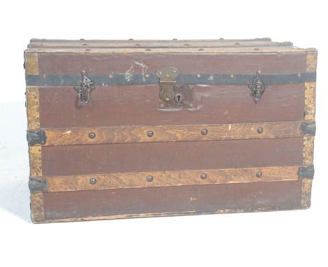 A 19th century Victorian shipping trunk / travelling trunk. The trunk of a rectangular form with hinged lid, wooden slats, ca
