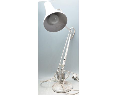 A retro vintage industrial 20th century Herbert Terry Anglepoise lamp having a conical light shade with a three arm support r