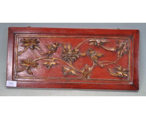An early 20th century circa 1920’s Chinese oriental wooden panel of a rectangular form with raised decoration depiction birds