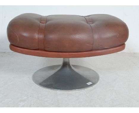 A vintage retro mid 20th century brown leather stool by Minty. The stool of a rectangular form with button top raised on a al